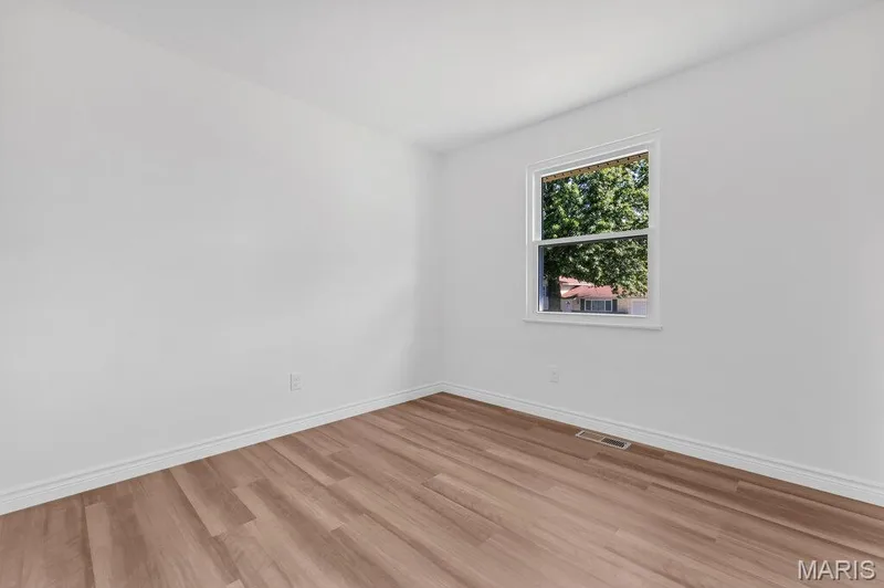 2nd bedroom with new flooring, fresh paint, and new baseboards — 15 Country Hill Road, St Peters, MO 63376