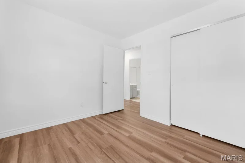 3rd bedroom with new flooring, fresh paint, and new baseboards — 15 Country Hill Road, St Peters, MO 63376