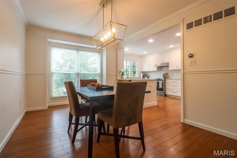 Bright and airy dining room opens to kitchen and living room — 2502 Forest Leaf Parkway, Wildwood, MO 63011