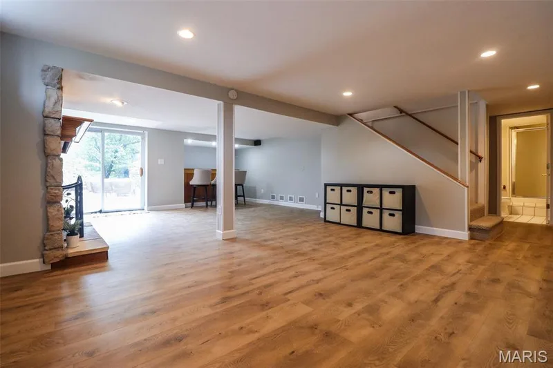 Finished lower level with wood laminate flooring — 2502 Forest Leaf Parkway, Wildwood, MO 63011