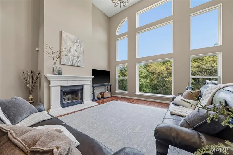 Great room with gorgeous view through the wall of windows! — 106 Crimson Oaks Court, Lake St. Louis, MO 63367