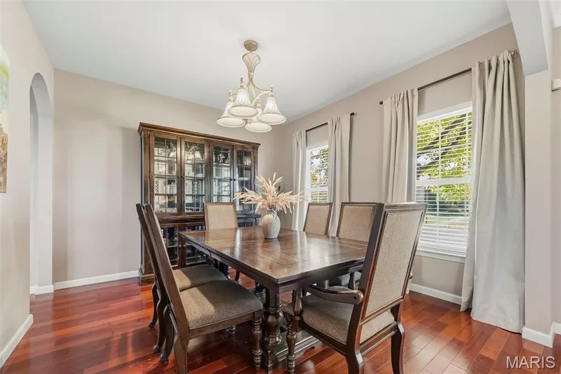 Dining room showcasing the beautiful Brazilian cherry hardwood — 106 Crimson Oaks Court, Lake St. Louis, MO 63367