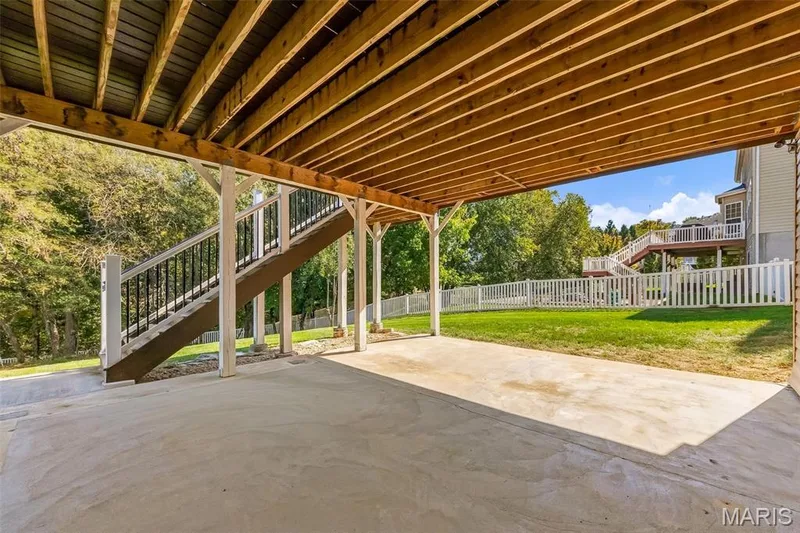 Patio underneath deck — 106 Crimson Oaks Court, Lake St. Louis, MO 63367