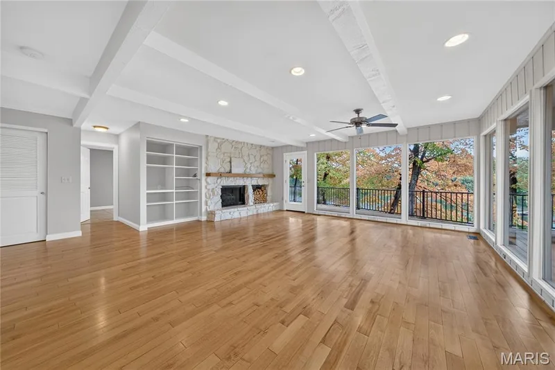 Gas fireplace, built in shelving and access to the deck — 2 Lakeview Court, Lake St. Louis, MO 63367