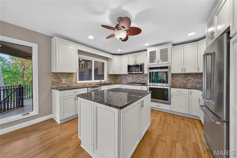 Center island, grante, backsplash, Kitchen Aid appliances, double oven — 2 Lakeview Court, Lake St. Louis, MO 63367