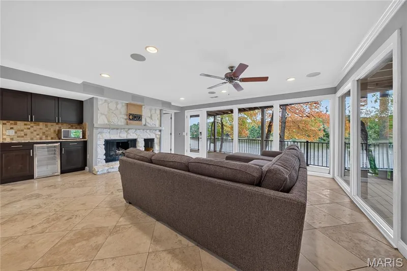 Gas fireplace, dry bar with beverage fridge and access to the deck with amazing views — 2 Lakeview Court, Lake St. Louis, MO 63367
