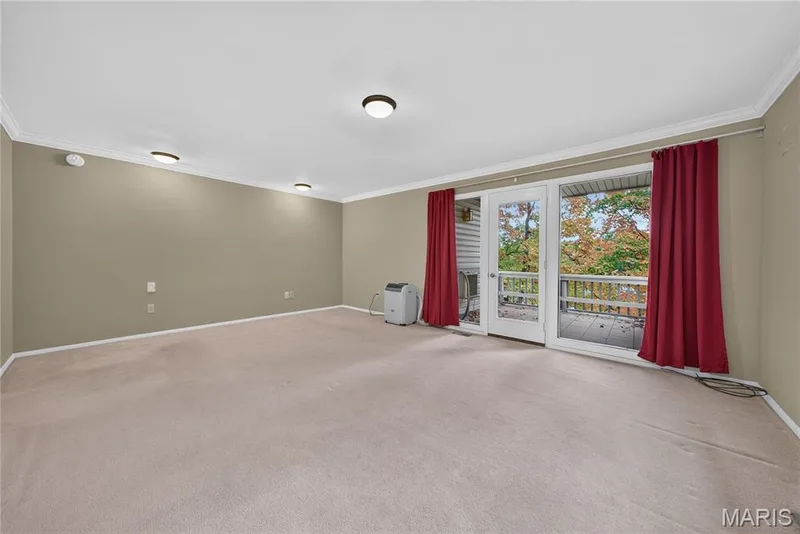 Upper level bedroom with private bathroom, walk in closet and private deck — 2 Lakeview Court, Lake St. Louis, MO 63367