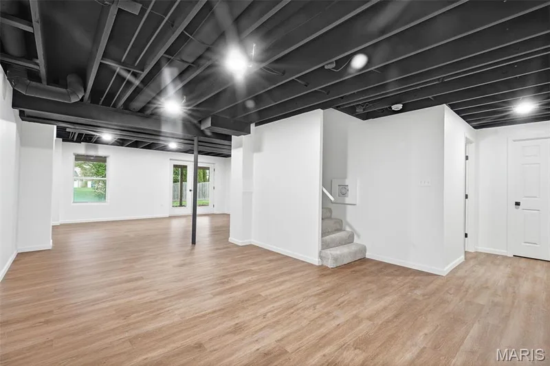 Finished lower level with appx. 900 sqft of finished space with three egress windows and a walkout French door — 2414 Tuckahoe Circle, O'Fallon, MO 63368