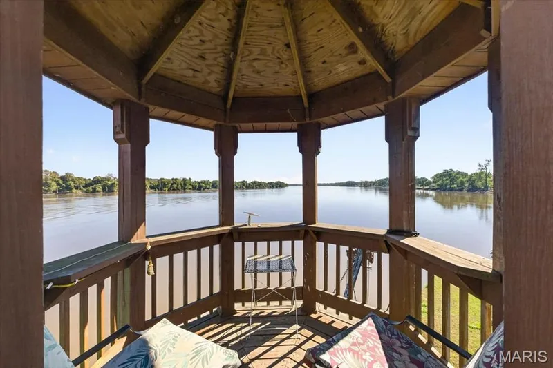 Octagonal wooden gazebo featuring a slatted railing, structural timber posts, and an exposed rafter ceiling — 69 Weule Boat Harbor, St Charles, MO 63301