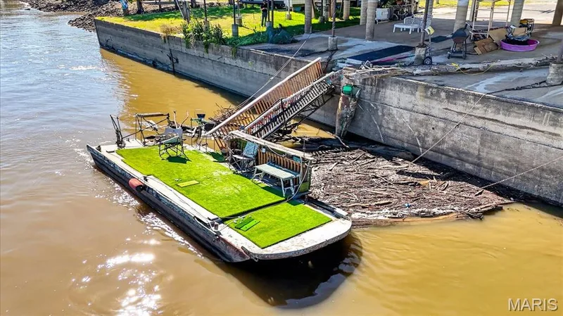Concrete bulkhead waterfront access featuring a fixed metal stairway — 69 Weule Boat Harbor, St Charles, MO 63301