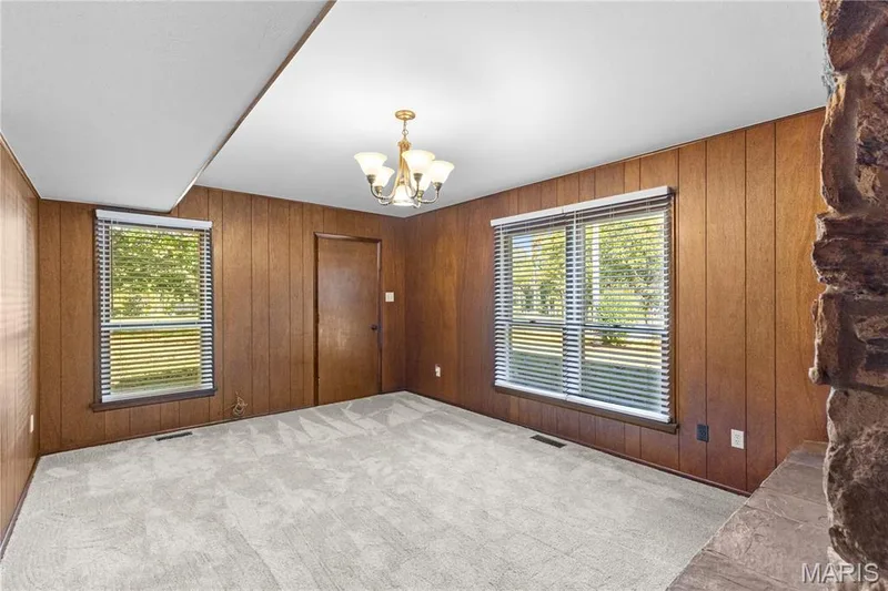 Family room with lots of natural light & newly installed carpet! — 15 Bridlewood Drive, Lake St. Louis, MO 63367