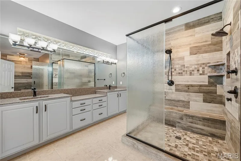 Primary bathroom with double vanity, separate walk in shower — 2221 Blue Lake Drive, Wentzville, MO 63385