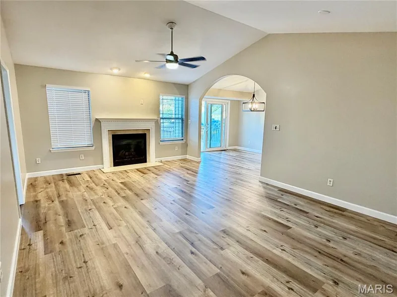 Great room with new vinyl plank flooring — 22 Ivy Brook Court, Wentzville, MO 63385