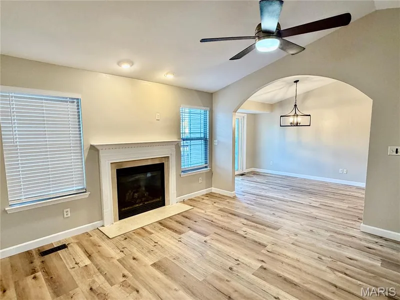 Gas Fireplace and arched entry in great room — 22 Ivy Brook Court, Wentzville, MO 63385