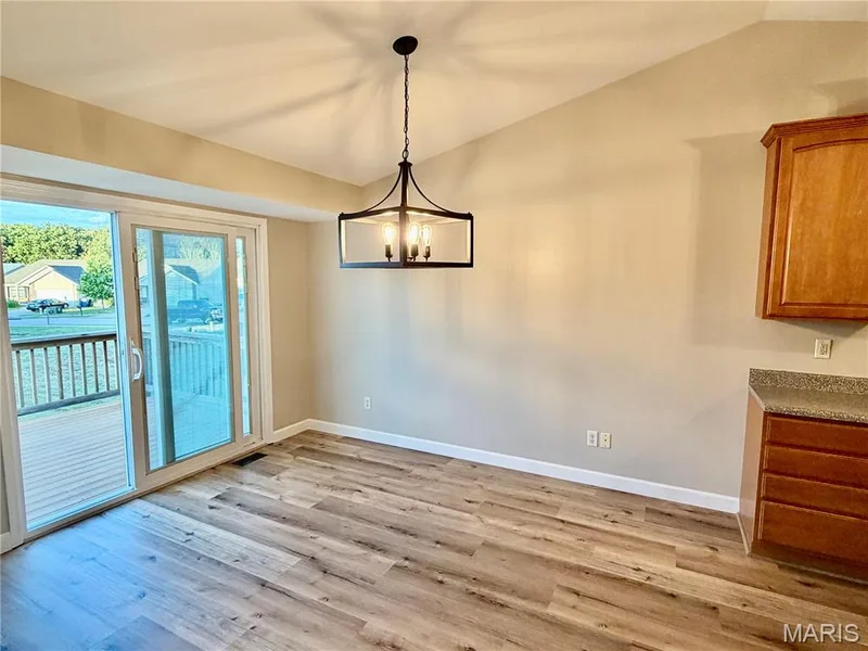 Breakfast area leading to deck — 22 Ivy Brook Court, Wentzville, MO 63385