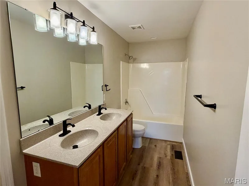 Primary bath suite with double vanity — 22 Ivy Brook Court, Wentzville, MO 63385
