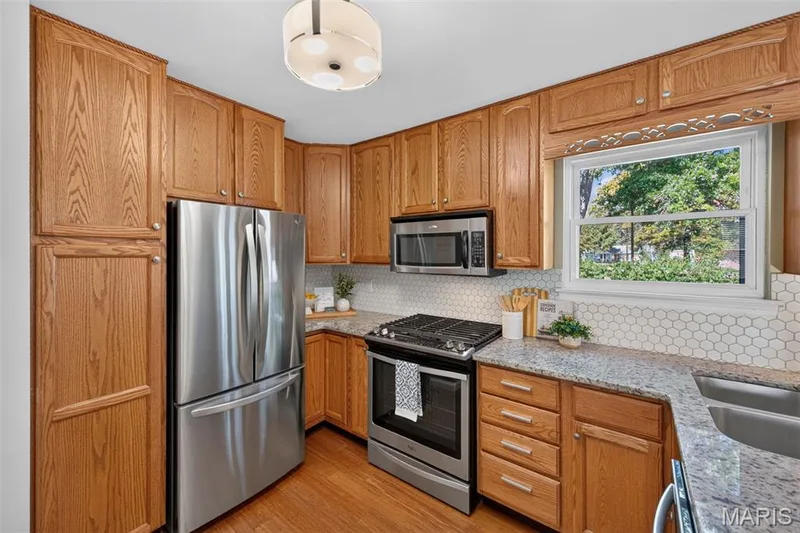 S/S Appliances in the kitchen with pantry space — 600 Turtle Creek Court, St Peters, MO 63376