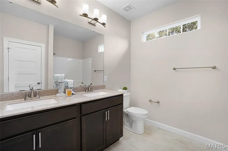Hall bath with dual vanity and linen closet — Cypress-Ests @ Schaper Farms, Foristell, MO 63348