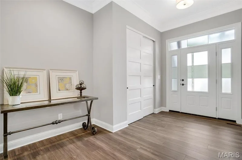 Entry Foyer with Optional Upgraded Etched Front Door, slatted 8 ft doors throughout interior and 10 ft ceilings. (Photo of previously built Sycamore - upgrades may be shown) — Sycamore-Ests @ Schaper Farms, Foristell, MO 63348
