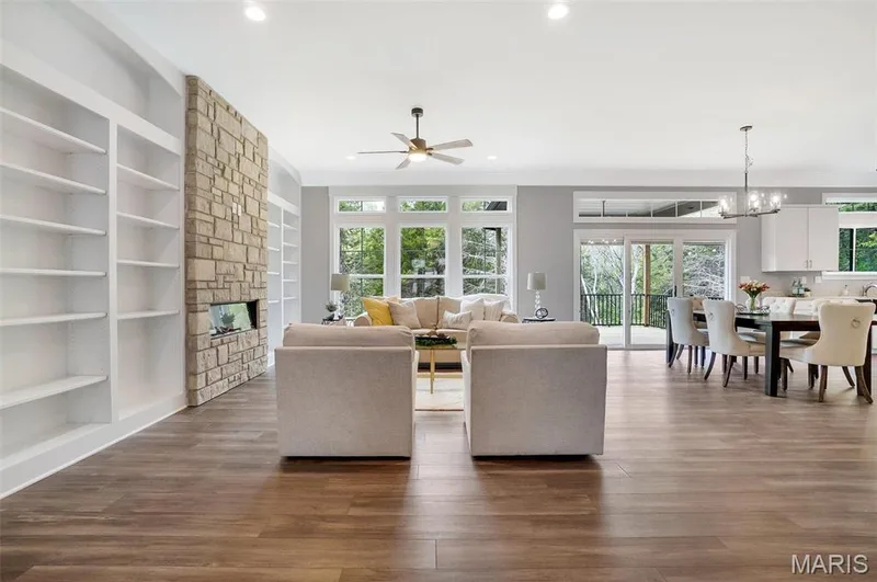 Optional upgraded features shown in Great Room include 10 ft ceilings and transoms along back. Custom Window Casings and Triple Slider Option. (Photo of previously built Sycamore - upgrades may be shown) — Sycamore-Ests @ Schaper Farms, Foristell, MO 63348