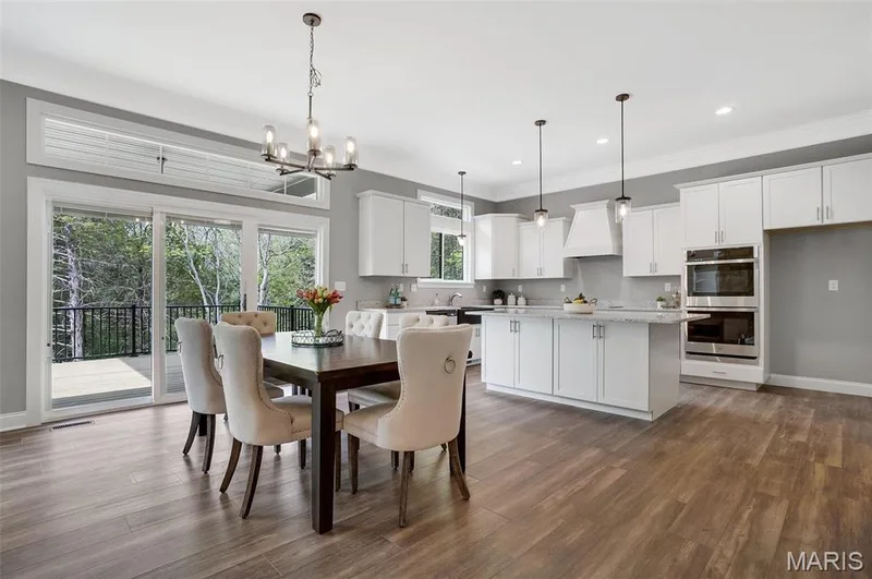 Triple slider with transoms and 10 ft ceilings. (Photo of previously built Sycamore - upgrades may be shown) — Sycamore-Ests @ Schaper Farms, Foristell, MO 63348