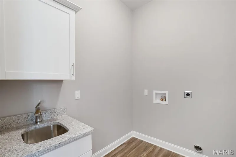 Laundry sink and cabinet in main floor laundry room. Additional cabinets also an option. (Photo of previously built Sycamore - upgrades may be shown) — Sycamore-Ests @ Schaper Farms, Foristell, MO 63348