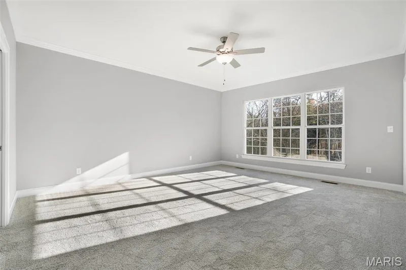 Standard Master suite with triple window, carpet and ceiling fan. Optional 1 pc crown molding has been added to this previously built home. (Photo of previously built Sycamore - upgrades may be shown) — Sycamore-Ests @ Schaper Farms, Foristell, MO 63348