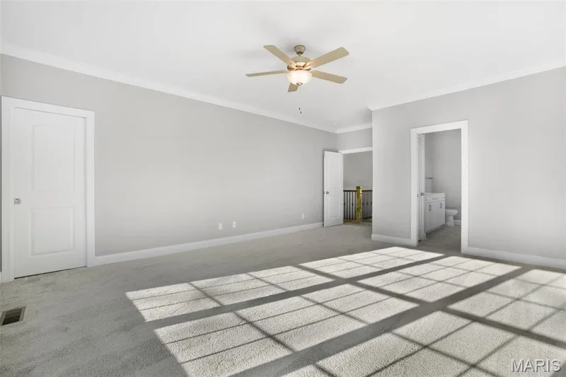 Standard master suite with carpeting and ceiling fan. 1 pc Crown molding option shown was added for this previously built home. (Photo of previously built Sycamore - upgrades may be shown) — Sycamore-Ests @ Schaper Farms, Foristell, MO 63348