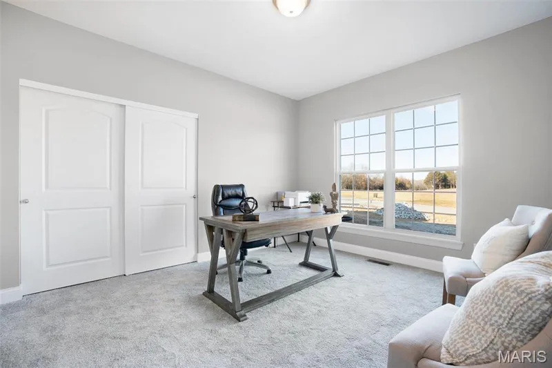 Standard Bedroom 2 with double window, carpet and 2 panel doors. (Photo of previously built Sycamore - upgrades may be shown) — Sycamore-Ests @ Schaper Farms, Foristell, MO 63348