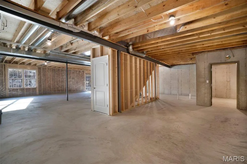 Full basement with walk out-option on most lots. Rough in bath along with optional safe room shown in photo. (Photo of previously built Sycamore - upgrades may be shown) — Sycamore-Ests @ Schaper Farms, Foristell, MO 63348