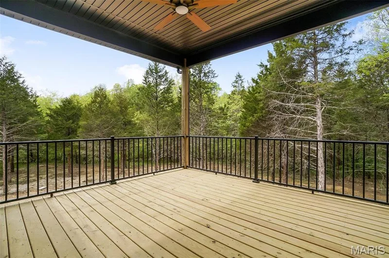 Covered deck with ceiling fan on previously built home (Photo of previously built Sycamore - upgrades may be shown) — Sycamore-Ests @ Schaper Farms, Foristell, MO 63348
