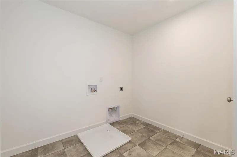 Laundry area featuring hookup for an electric dryer and hookup for a washing machine — 717 Southerland Drive, O'Fallon, MO 63368