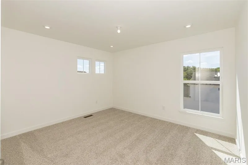 Carpeted empty room featuring recessed lighting — 717 Southerland Drive, O'Fallon, MO 63368