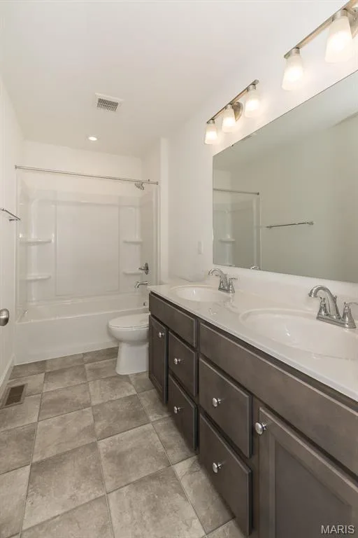 Bathroom with bathing tub / shower combination and double vanity — 717 Southerland Drive, O'Fallon, MO 63368
