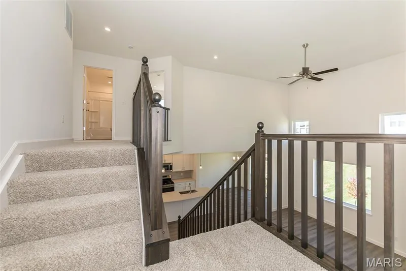 Staircase with a ceiling fan and recessed lighting — 717 Southerland Drive, O'Fallon, MO 63368