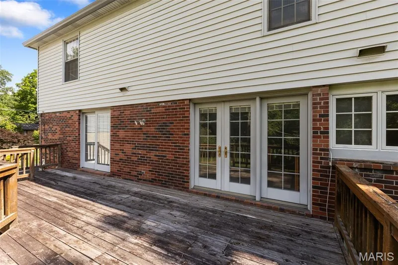 Deck is accessible from both the Kitchen and the Paneled hearth room. — 14336 Bramblewood Court, Chesterfield, MO 63017